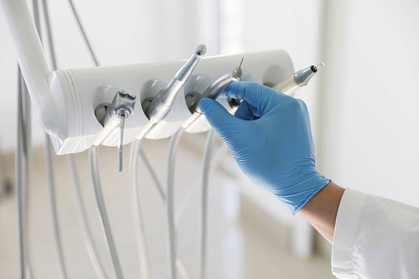Professional Tooth Extraction technician working in Alexandria, VA